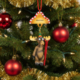 Moose ornament with skis and 'Montana' hat on a white background