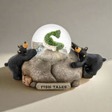 Decorative figurine with two bears and a snow globe labeled 'Fish Tales' on a white background