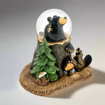 Decorative figurine with bear, trees, and a small animal on a white background