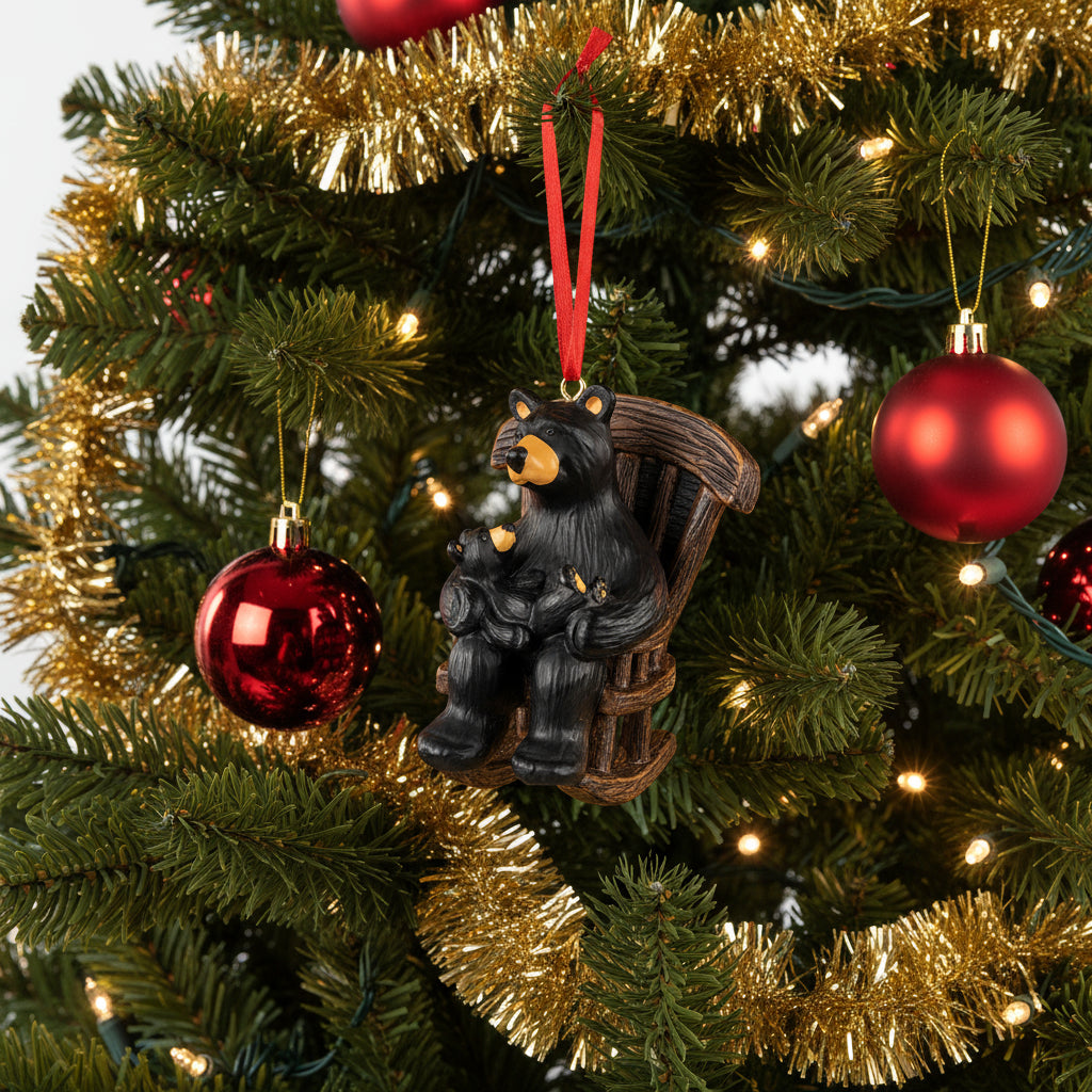 Decorative ornament of a bear and cub on a rocking chair with a red ribbon on a white background