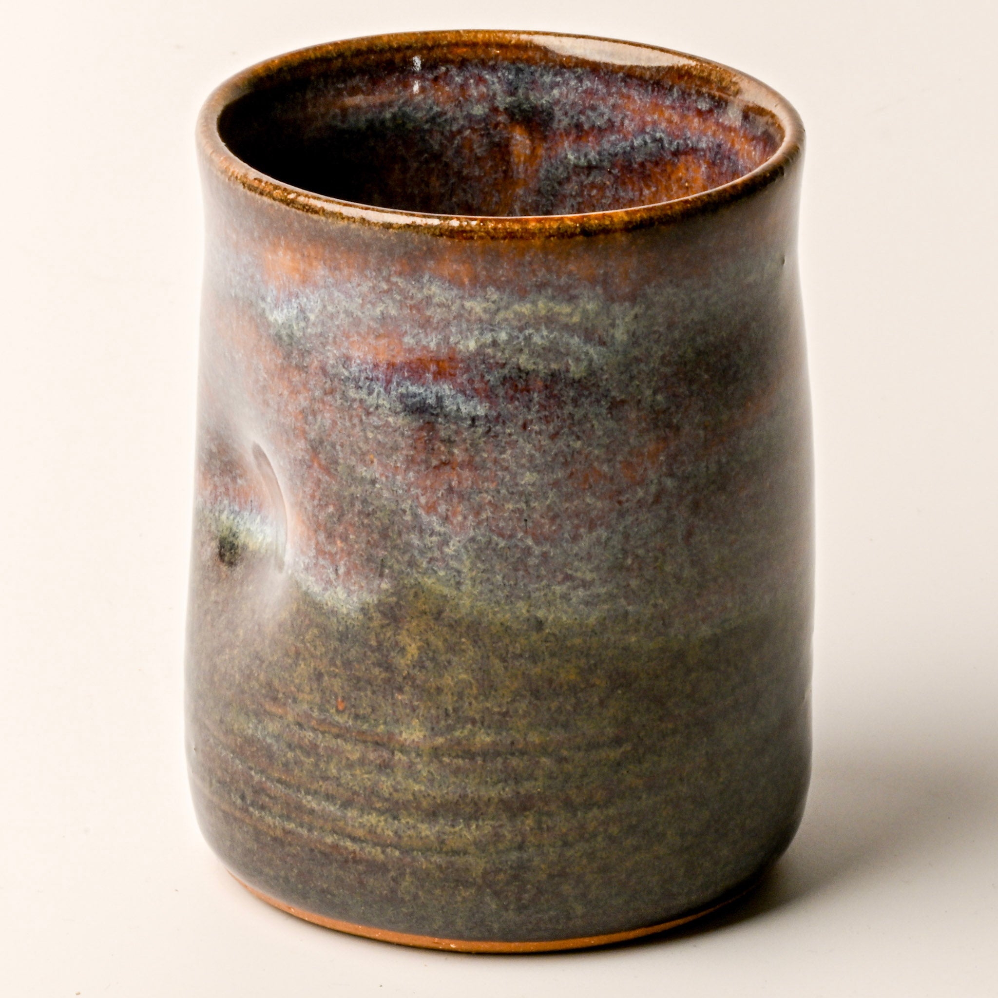 Ceramic mug with a textured surface on a white background