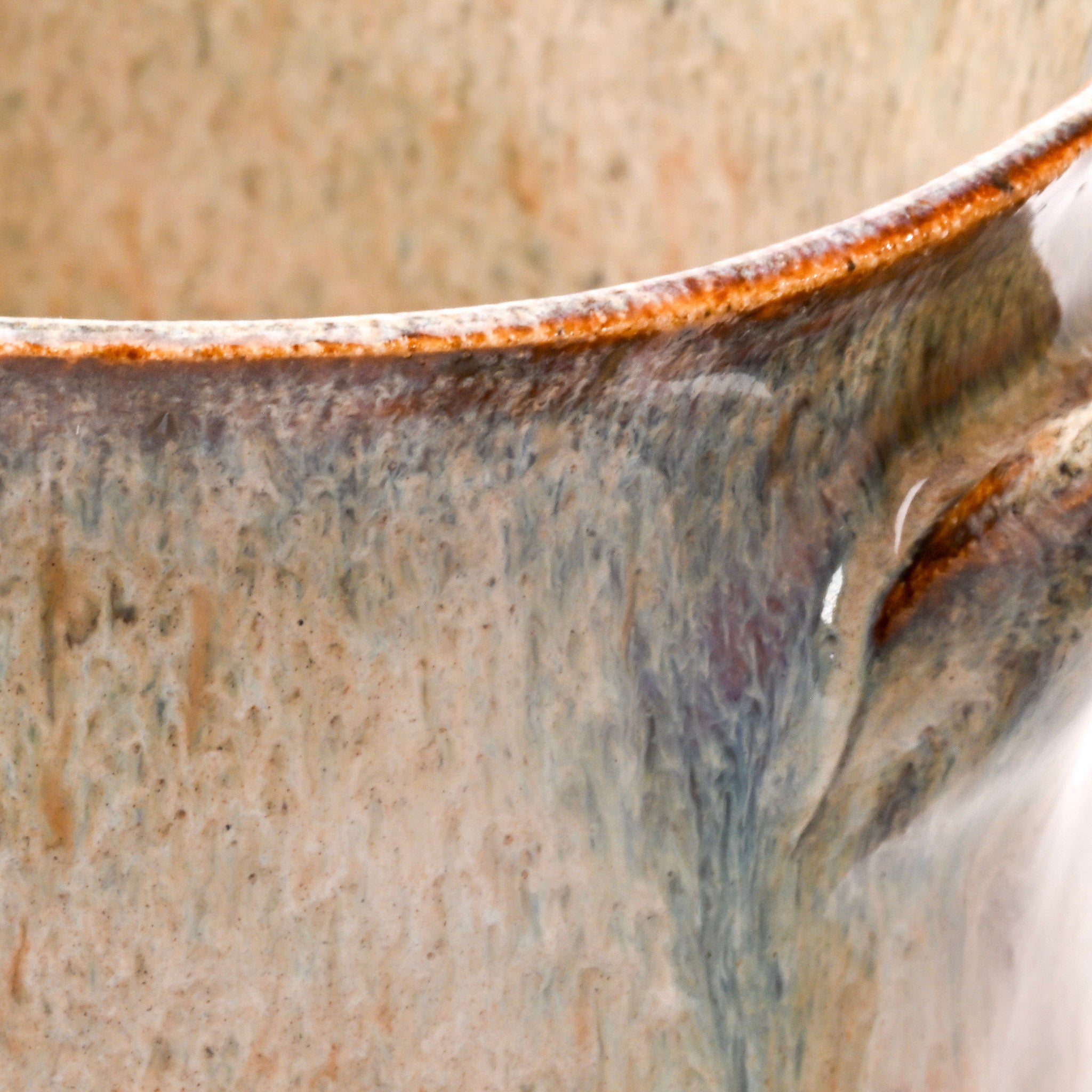 Close-up of a ceramic mug with a textured surface