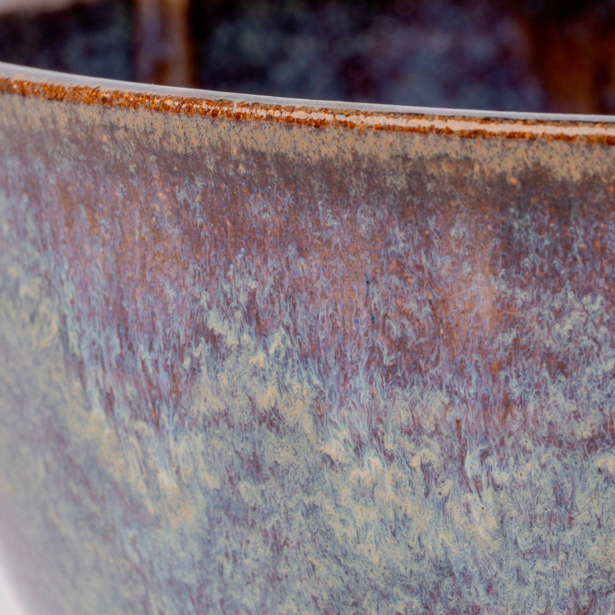 Close-up of a ceramic cup with a textured surface