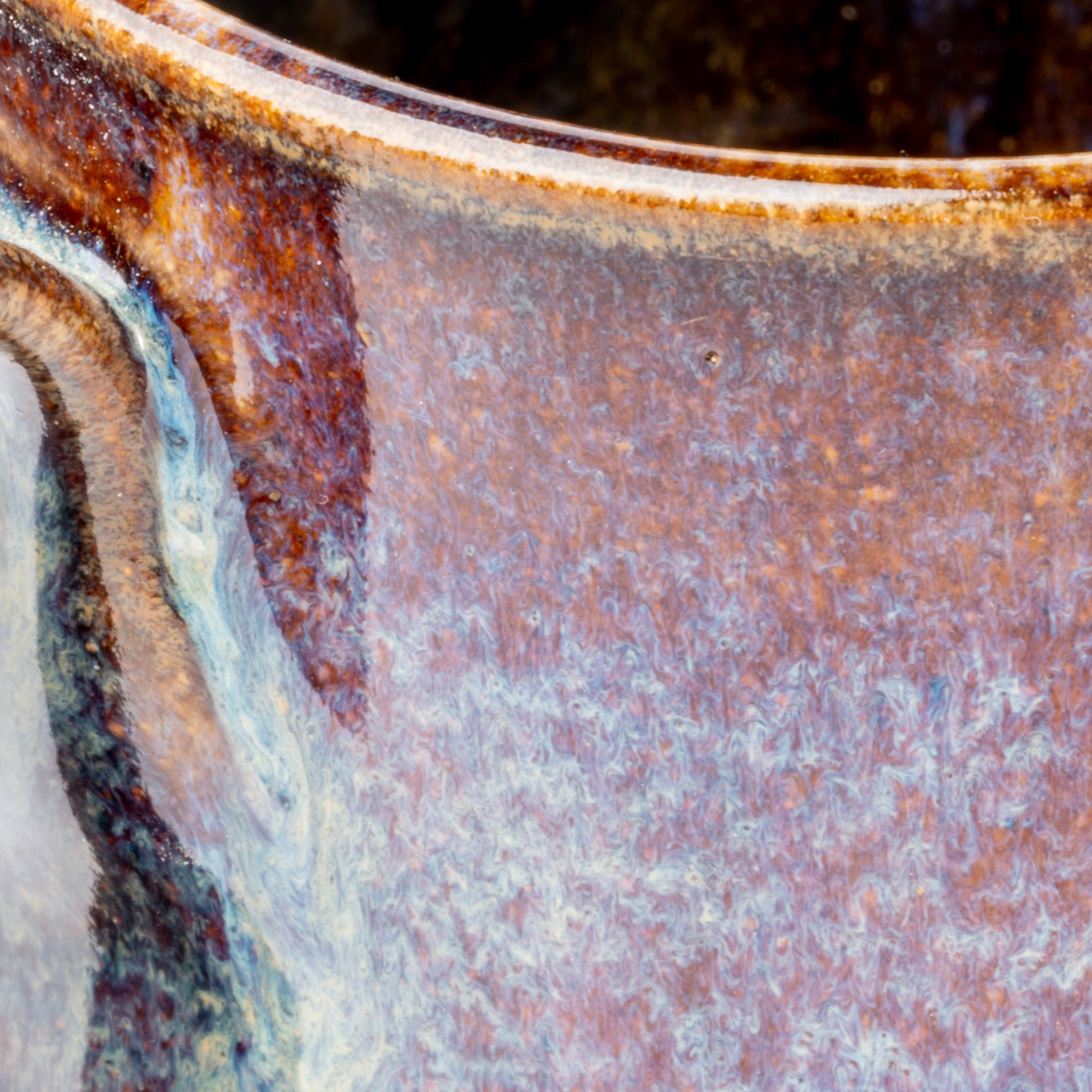 Close-up of a textured ceramic surface with brown and beige tones