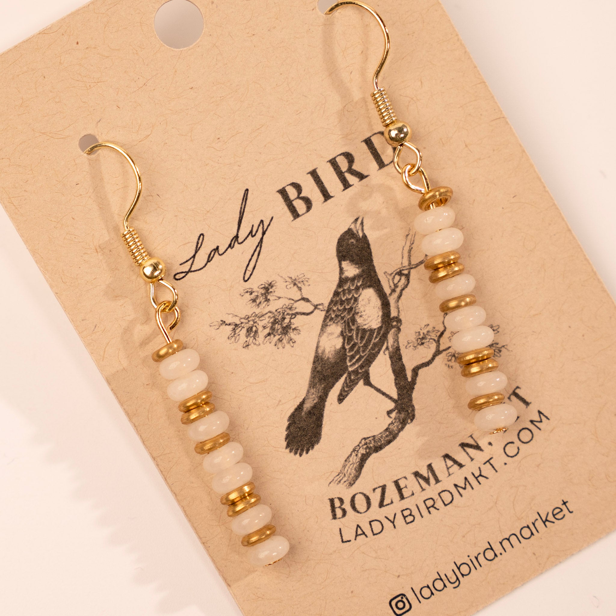 Gold White Opal Dangle Gemstone Earrings - close up