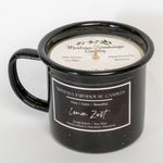 Black mug candle with 'Montana Farmhouse Candles' label on a white background