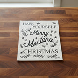 Decorative sign with text 'Have Yourself A Merry Montana Christmas' on a white background