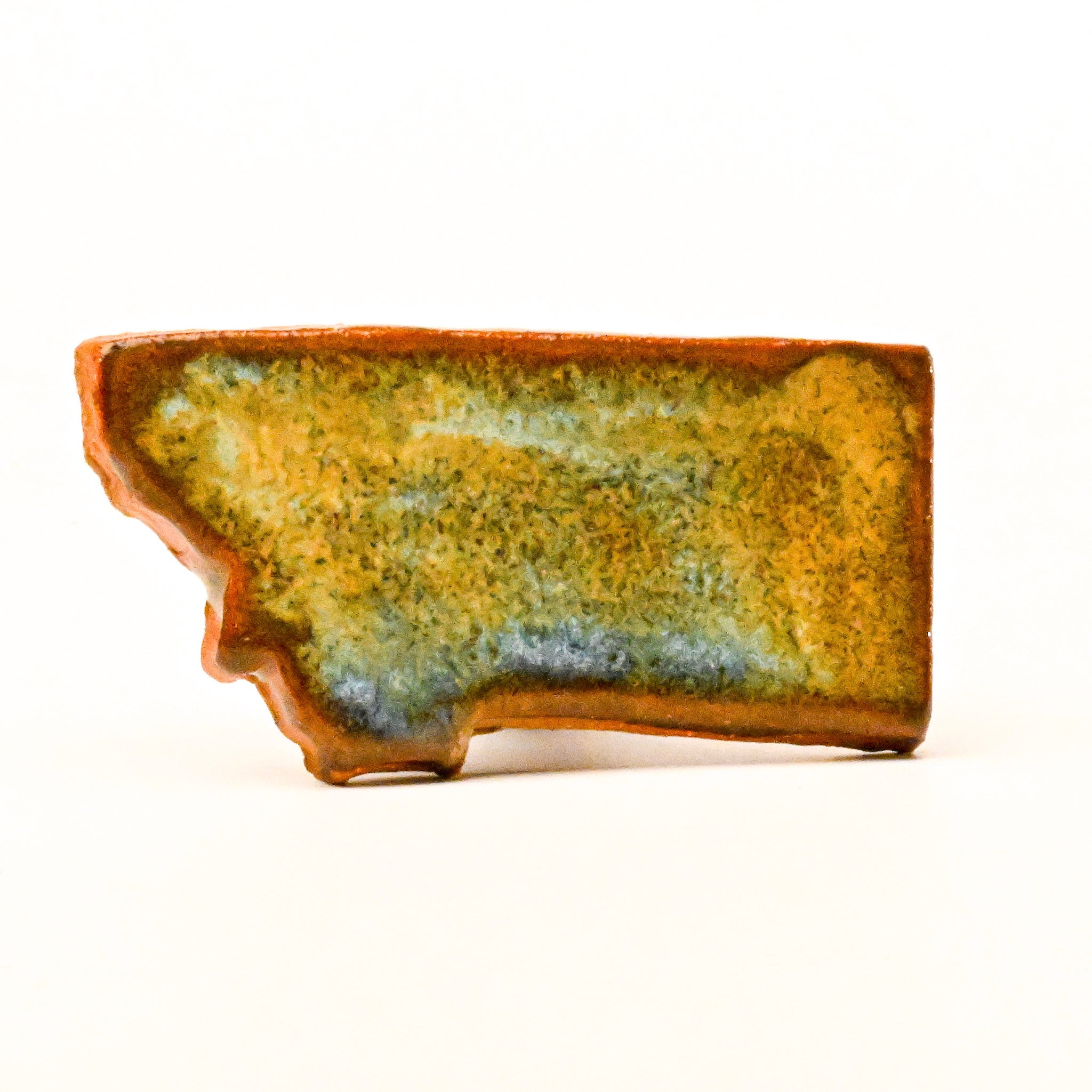 Ceramic magnet with a textured surface on a white background