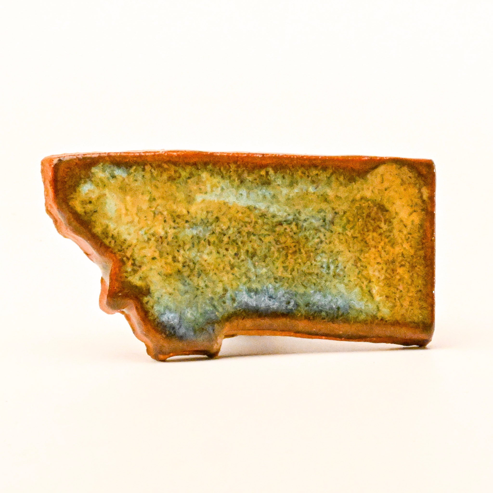 Ceramic magnet with a textured surface on a white background