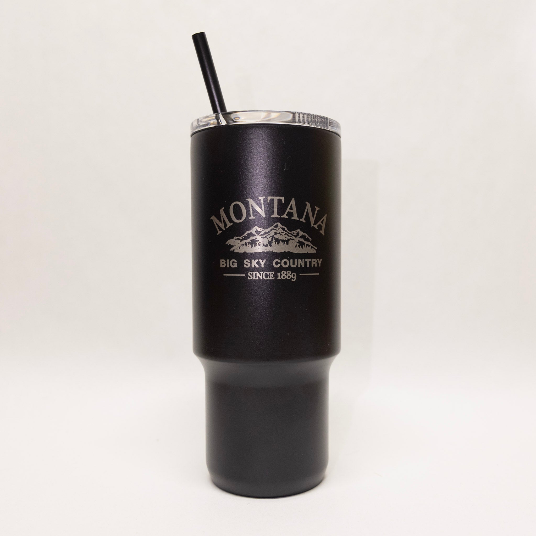Black tumbler with 'Montana Big Sky Country Since 1899' text on a white background