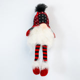Plush gnome toy with red and black checkered hat and striped socks on a white background