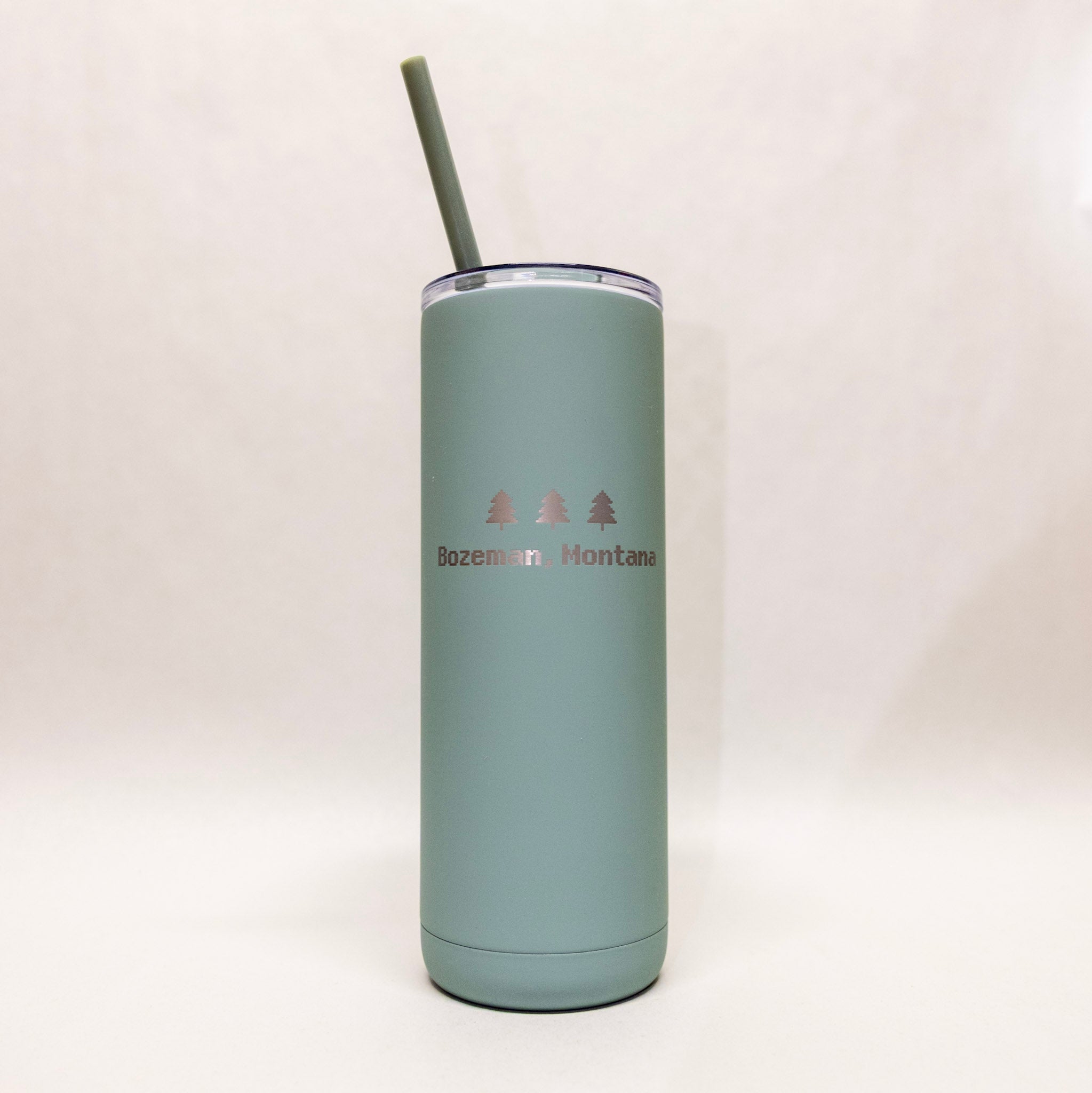 Mint green tumbler with 'Bozeman Montana' text on a white background