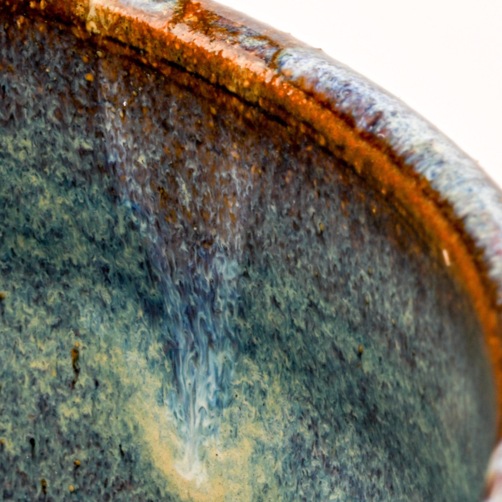Close-up of a ceramic plate with a textured surface