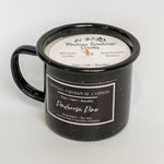 Black mug with candle inside, featuring Montana Farmhouse Candles branding.