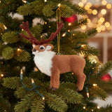 Plush reindeer ornament with brown antlers on a white background