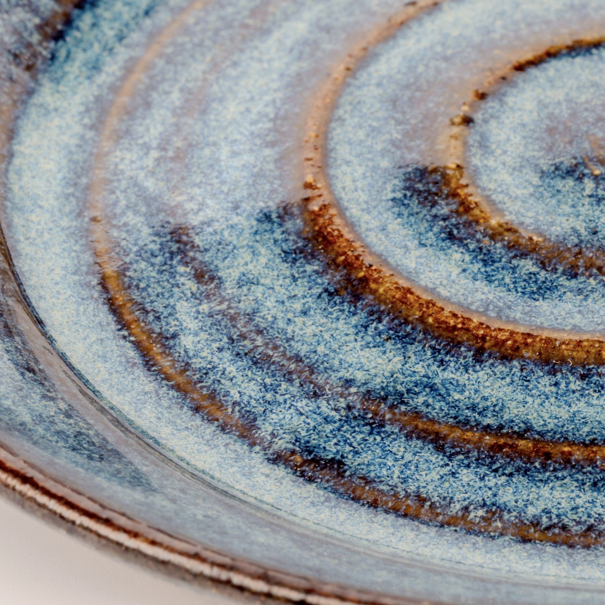 Close-up of a ceramic plate with concentric circular patterns