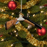 Decorative glass shotgun ornament on a white background