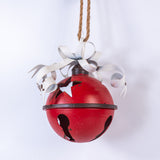 Red bell with white ribbons on a white background