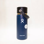Blue Hydro Flask water bottle with black lid on a white background