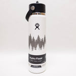 White Hydro Flask water bottle with tree design and black lid on a white background