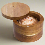 The Acacia Salt Box by Totally Bamboo is a stunning dark wood cylindrical container with a magnetic lid closure.