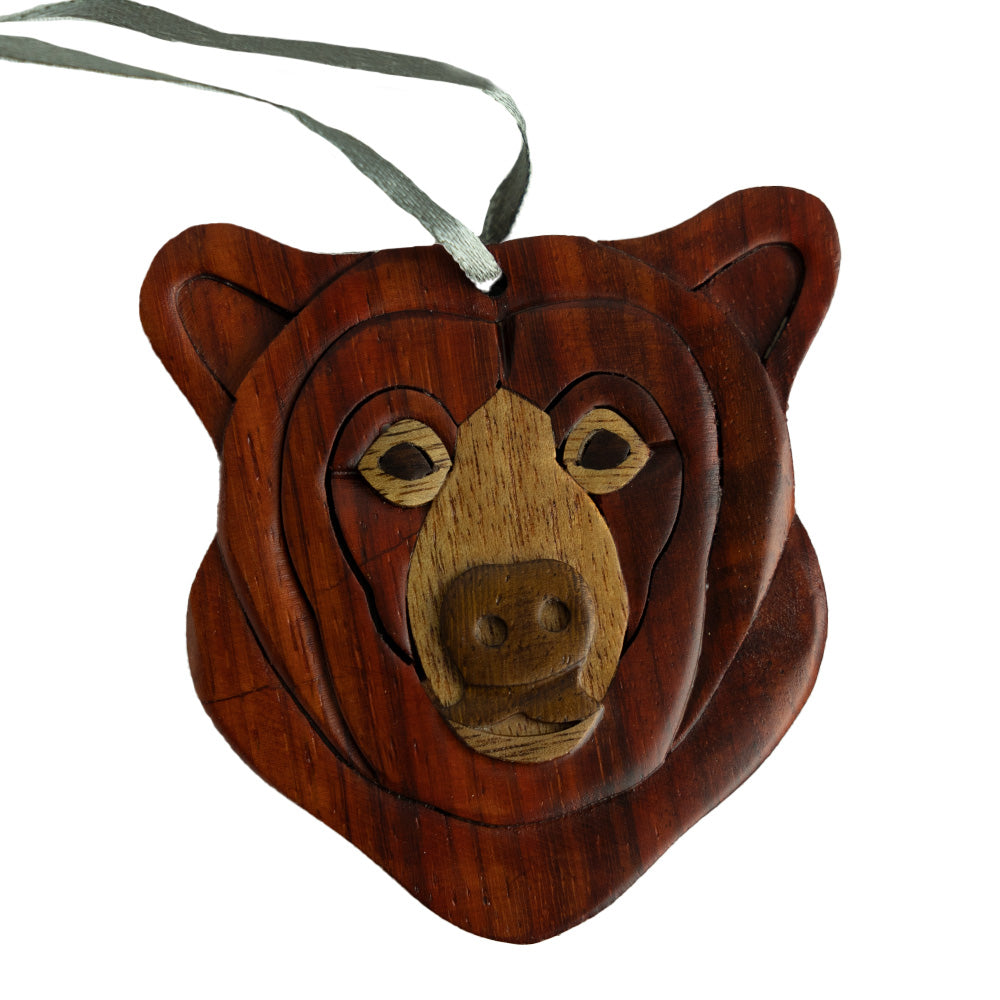 We love the Wood Bear Ornament by The Handcrafted because it uses layers of wood to craft the face.