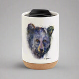 Enjoy the colorful and stylish art of Dean Crouser while you sip a warm drink with the Dean Crouser Cork Bottom Bone Tumbler by Demdaco.