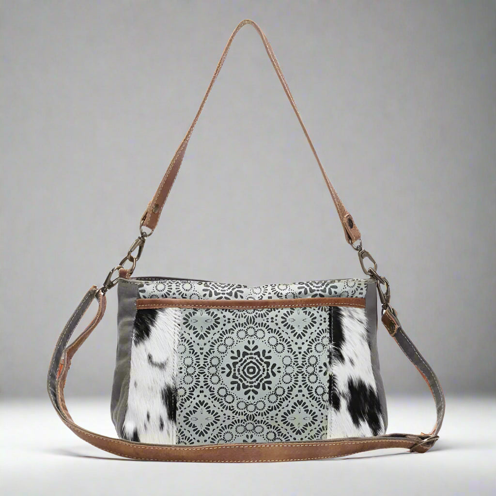 The Dual Strap Cross Body Bag by Myra Bag is a beautiful cohesive combination of canvas, leather, and hairon to bring you your perfect purse.