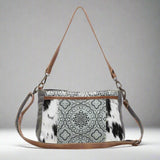 The Dual Strap Cross Body Bag by Myra Bag is a beautiful cohesive combination of canvas, leather, and hairon to bring you your perfect purse.