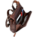 The Floral Slim Crossbody Bag by Jack Georges is made from hand-stained Buffalo leather with an embossed floral design on the front pocket flap.