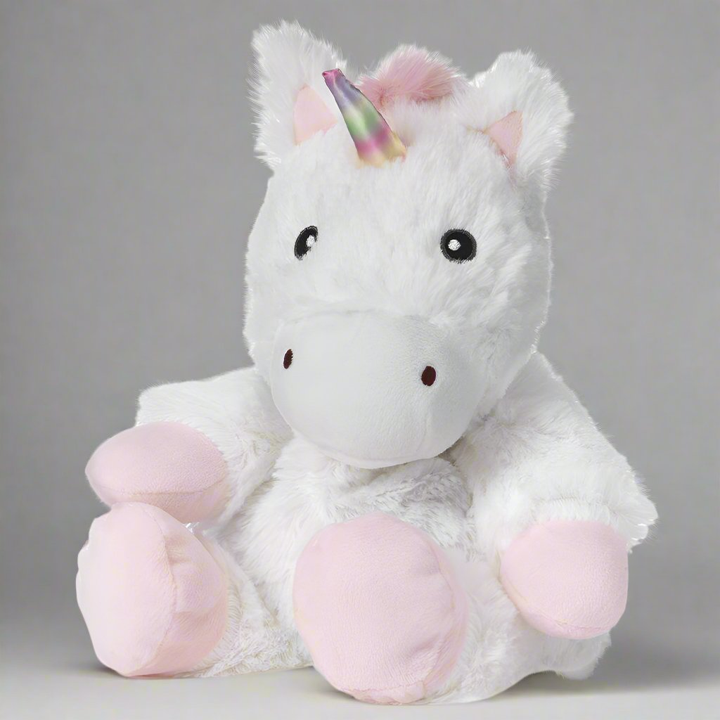 Warmies unicorn with white fur, light pink hooves, and a rainbow horn.
