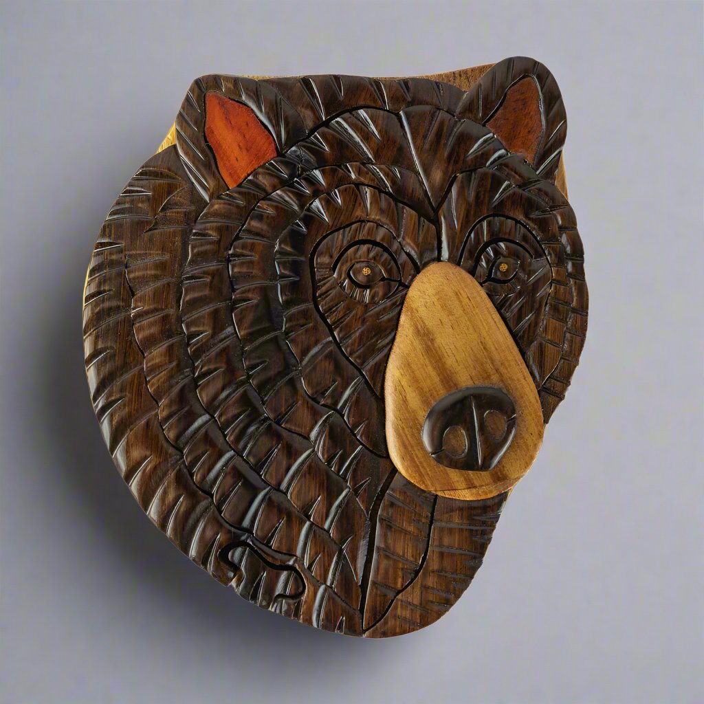The Wood Carved Black Bear 2 Puzzle Box by The Handcrafted includes a small mechanism that acts as a lock to keep this box together and it stimulates the brain each time you open it.