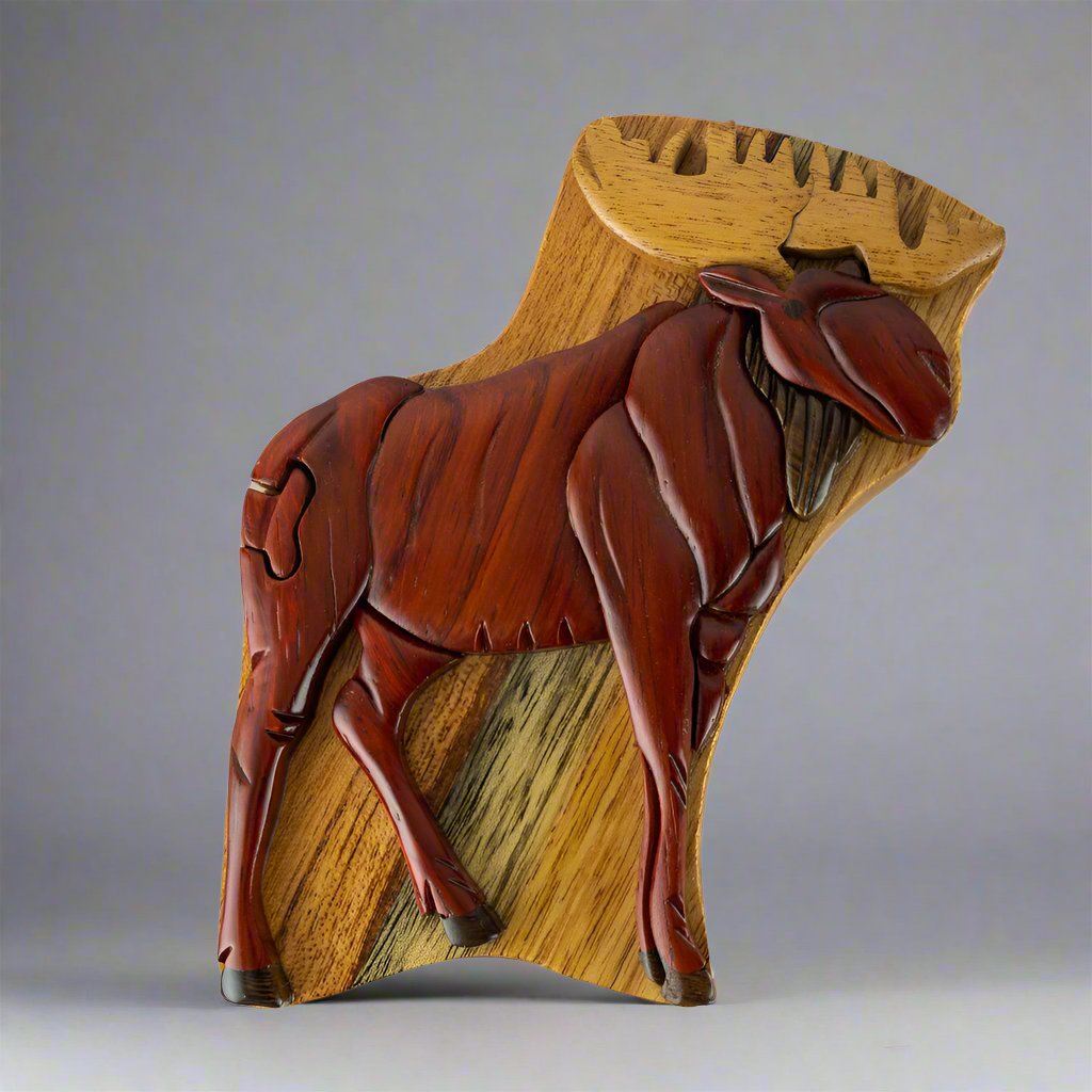 The Wood Carved Standing Moose Puzzle Box by The Handcrafted is a beautifully, crafted box featuring a stunning moose on the front.