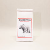 Packaging of 'Bear Droppings' yogurt pretzel bites with a bear illustration on a beige background