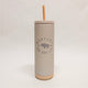 Gray tumbler with straw lid featuring 'Montana the Good Life' text on a light gray background