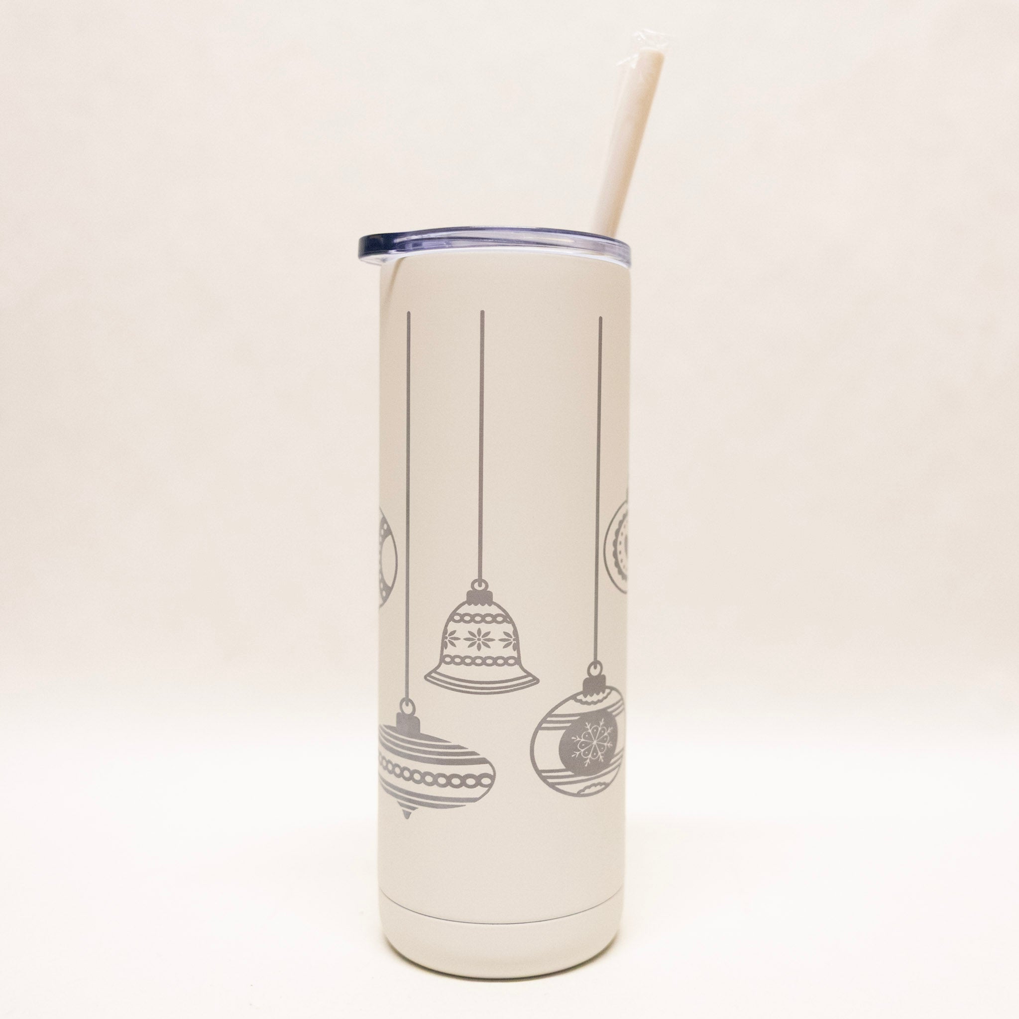 Tumbler with Christmas ornament design on a white background