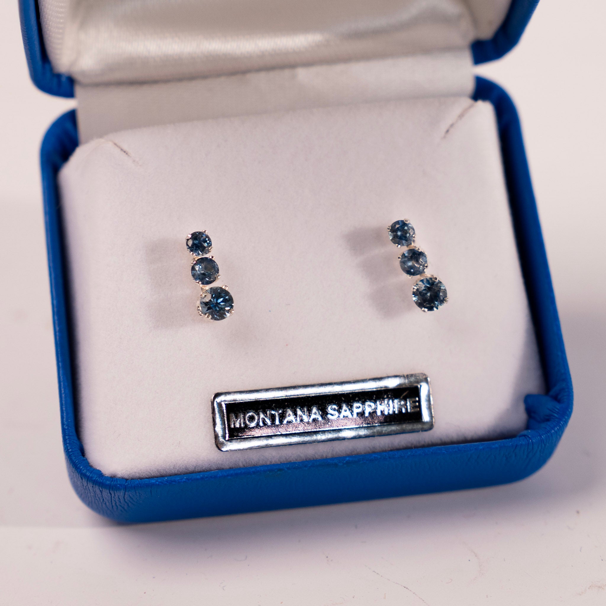 Three Stone Four Prong Montana Sapphire Earrings by Mac's Gems