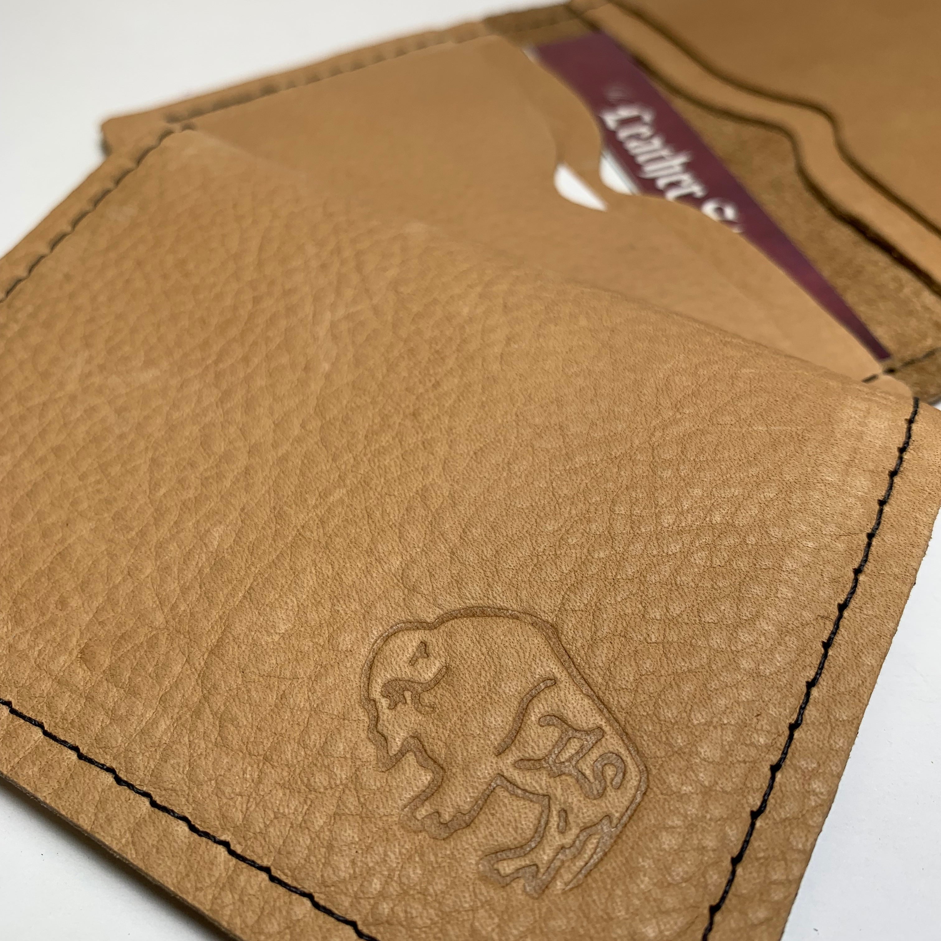 Brown leather wallet with a logo on a white background
