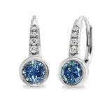 Pair of silver earrings with blue gemstones on a white background