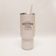 Beige tumbler with 'Bozeman Montana' text and mountain graphic on a white background