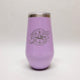 Purple tumbler with a compass design and text on a white background