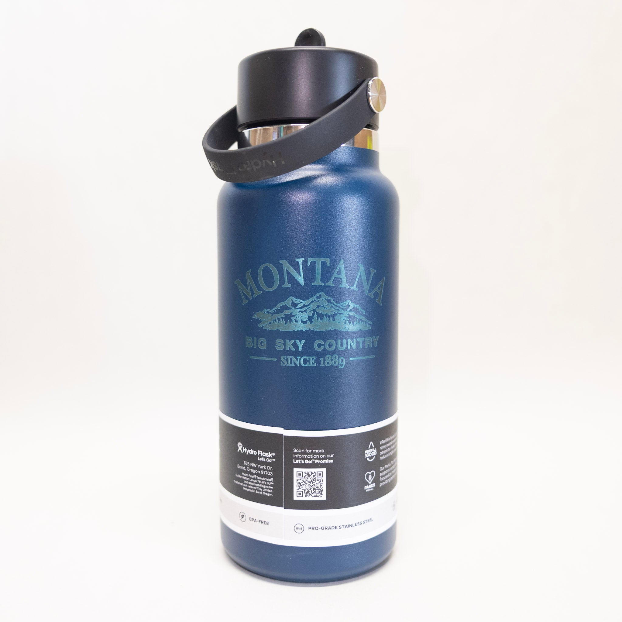 Blue water bottle with 'Montana Big Sky Country' branding on a white background