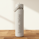 off-White water bottle with 'Bozeman Montana' text on a wooden surface