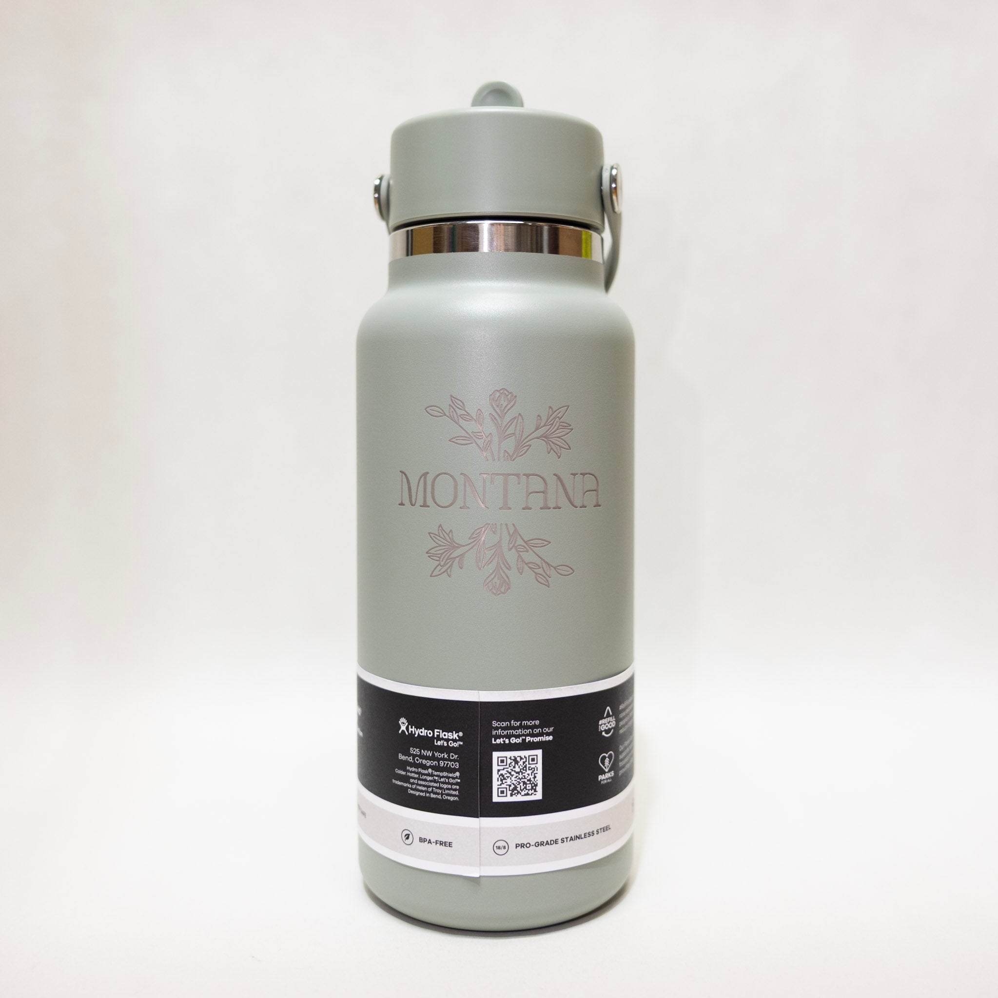 green water bottle with 'Montana' branding on a white background