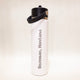 White water bottle with black cap and 'Bozeman, Montana' text on a light beige background
