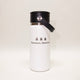 White insulated bottle with black lid and 'Bozeman, Montana' text on a white background