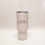 White tumbler with 'Bozeman, Montana' text and tree graphics on a white background