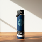 Blue water bottle with a black cap on a wooden surface