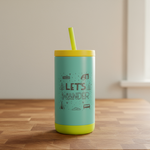 Turquoise tumbler with yellow lid and straw on a wooden surface