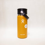 Yellow Hydro Flask bottle with black lid on a white background